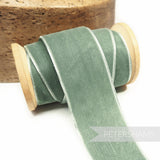 Petershams Millinery Supplies 36mm vintage mint French velvet ribbon on a wooden spool for craft and millinery projects.