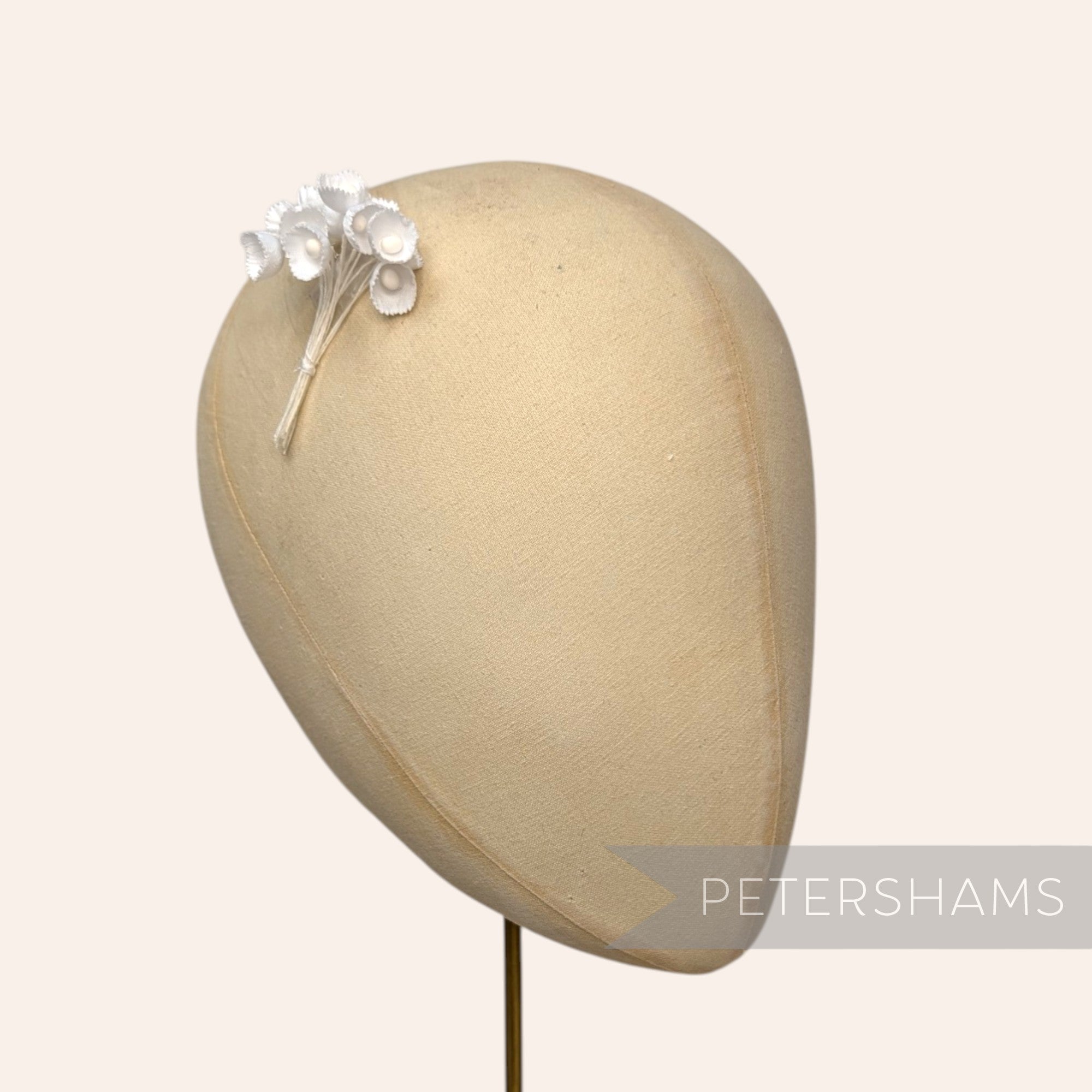 Petershams Millinery Supplies Alicia teeny white silk lily of the valley flower stems on a millinery head block
