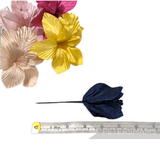 Petershams Millinery Supplies silk orchid hat flowers in pink, yellow, and navy blue with a measuring tape for scale.