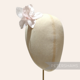 Petershams Millinery Supplies Coco silk orchid flower hat mount in soft pale pink on a millinery display head