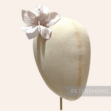 Petershams Millinery Supplies Coco silk orchid flower hat mount in soft pink on a millinery head block