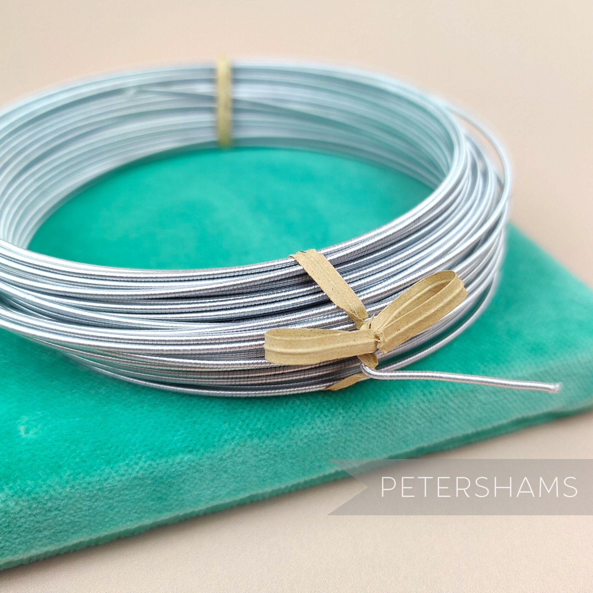 Petershams Millinery Supplies 1.2mm silver rayon covered millinery wire coiled