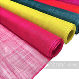 Petershams Millinery Supplies sinamay fabric rolls in fuchsia, yellow, teal, and orange. Lightweight, woven material for hat making.