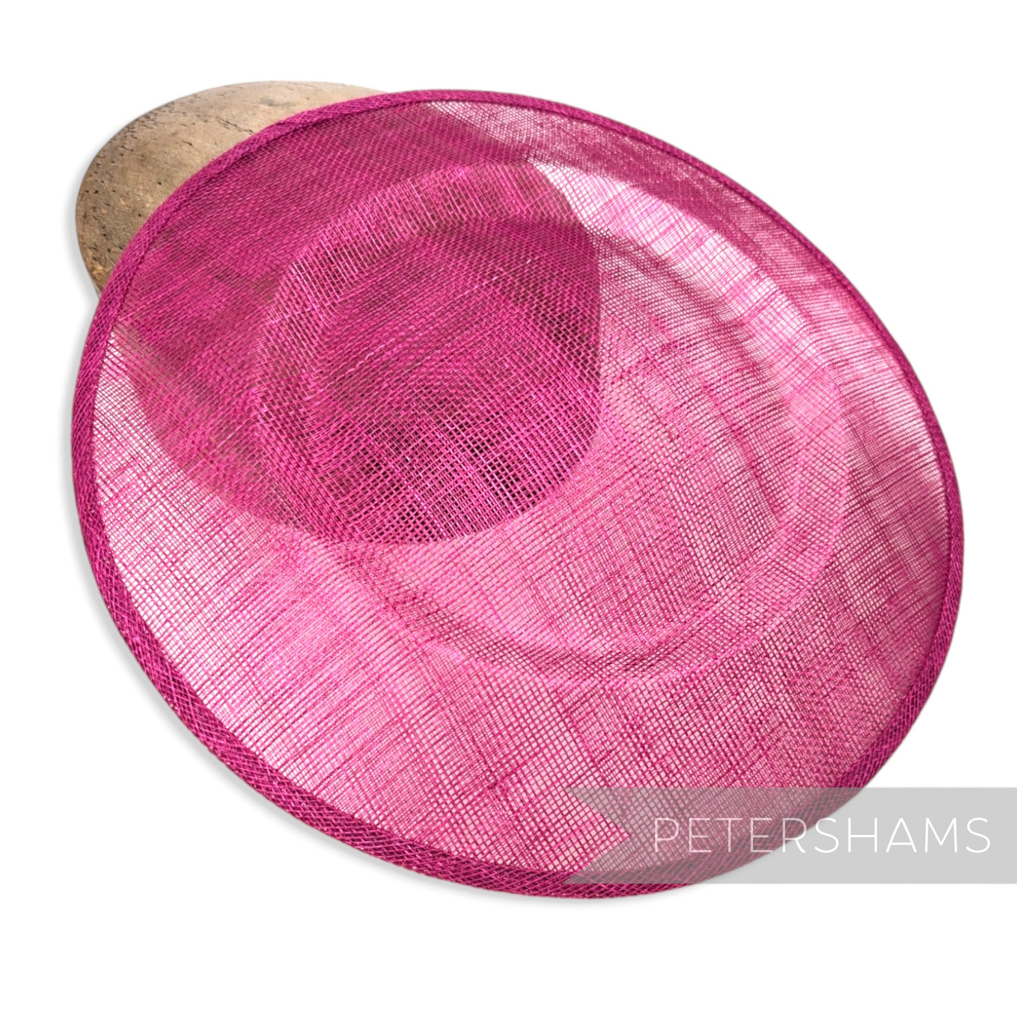 Petershams Millinery Supplies 29cm large round pink sinamay fascinator hat base with shallow crown curvature.