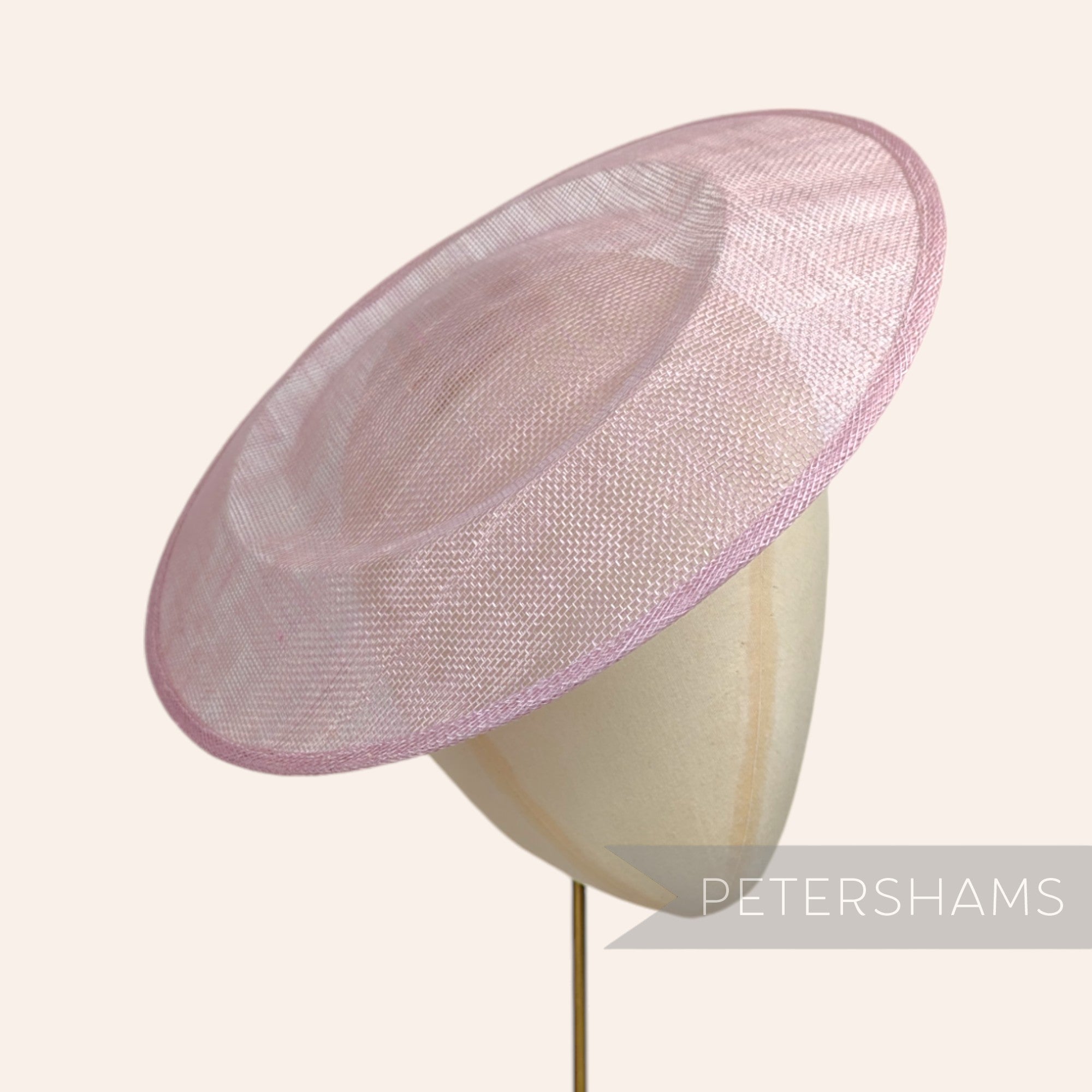 Petershams Millinery Supplies large round heather sinamay fascinator hat base on a millinery head form