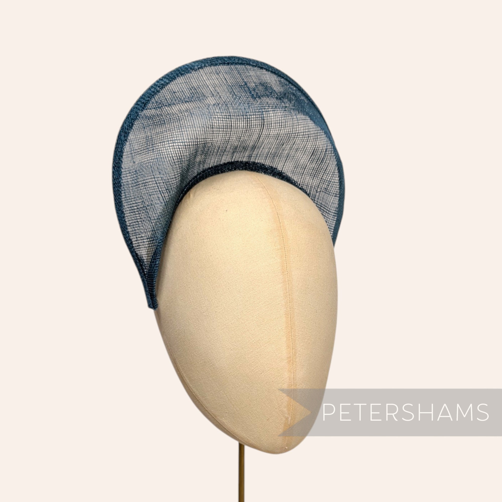 Petershams Millinery Supplies teal sinamay halo crown fascinator hat base on a mannequin head