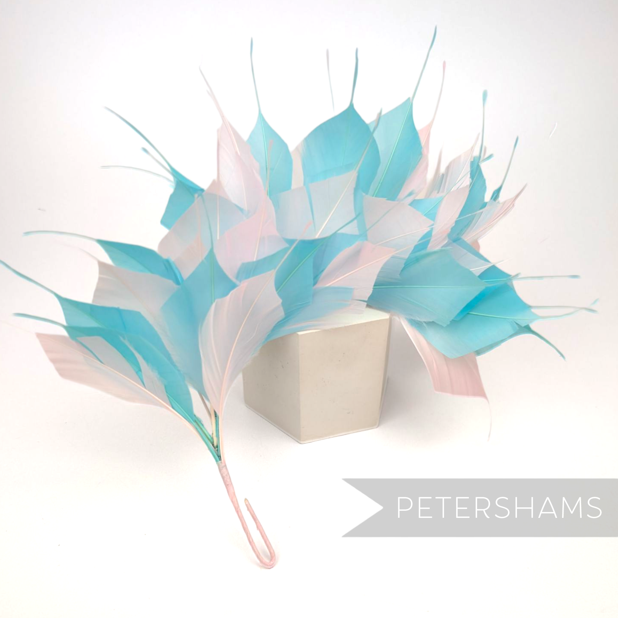 Petershams Millinery Supplies large spiky goose feather hat mount in pastel blue and pink on a wired stem