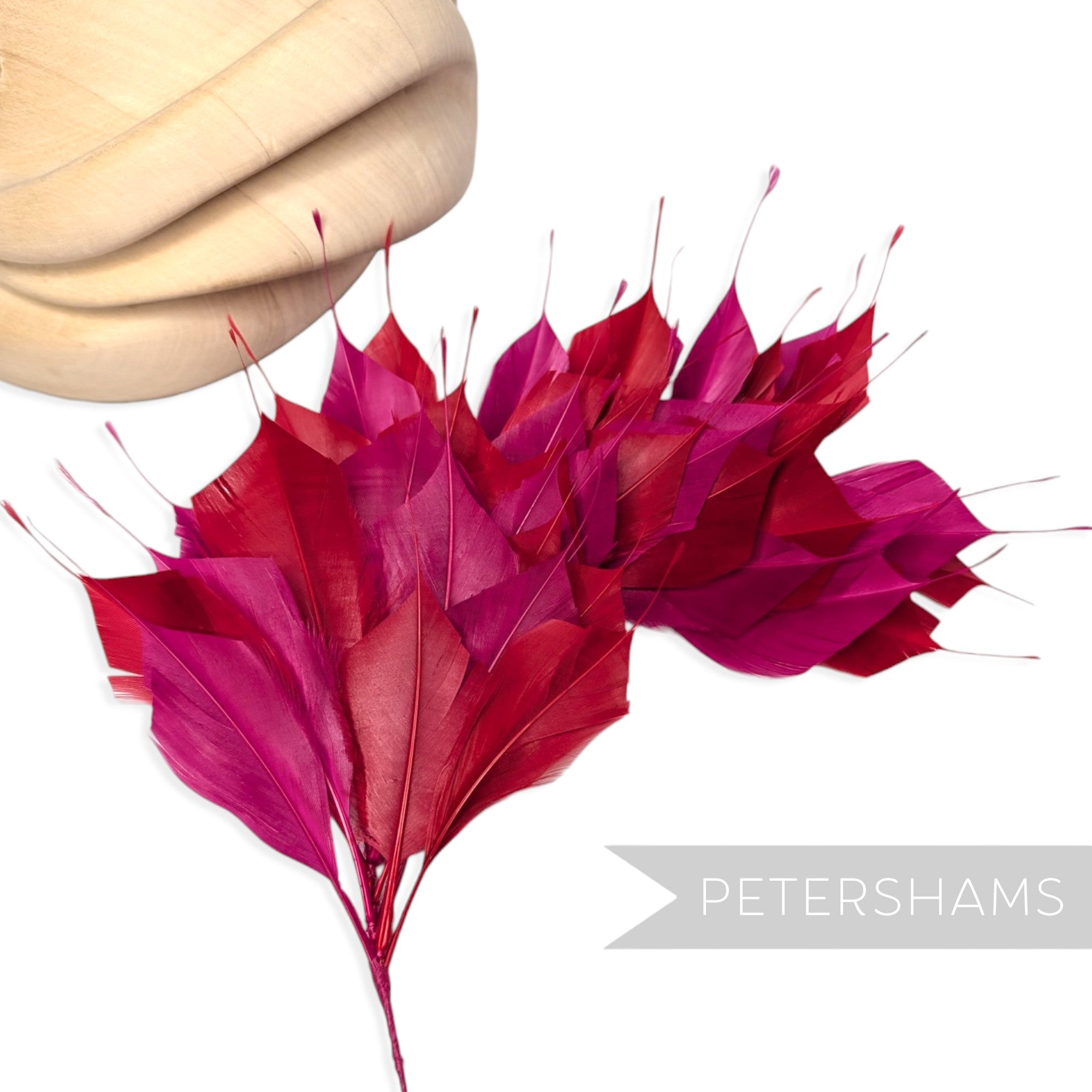 Petershams Millinery Supplies large cerise and red spiky goose feather wired hat mount for millinery projects.