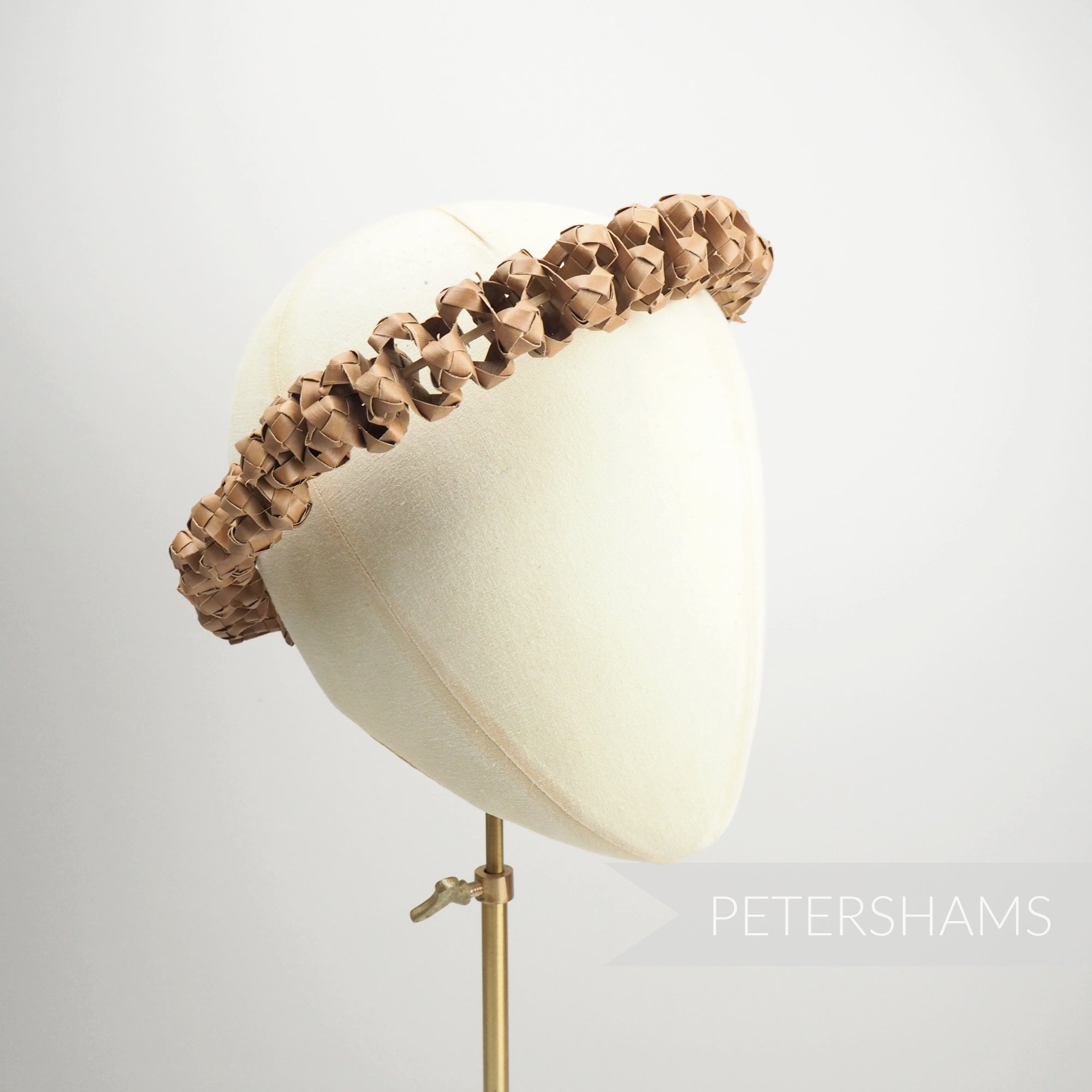 Petershams Millinery Supplies handwoven straw headdress frame featuring an adjustable design.