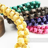 Petershams Millinery Supplies handwoven straw adjustable headdress frames in yellow, green, brown, purple, and pink.