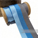 Petershams Millinery Supplies 45mm wide vintage striped grosgrain ribbon in shades of light blue and grey on a spool