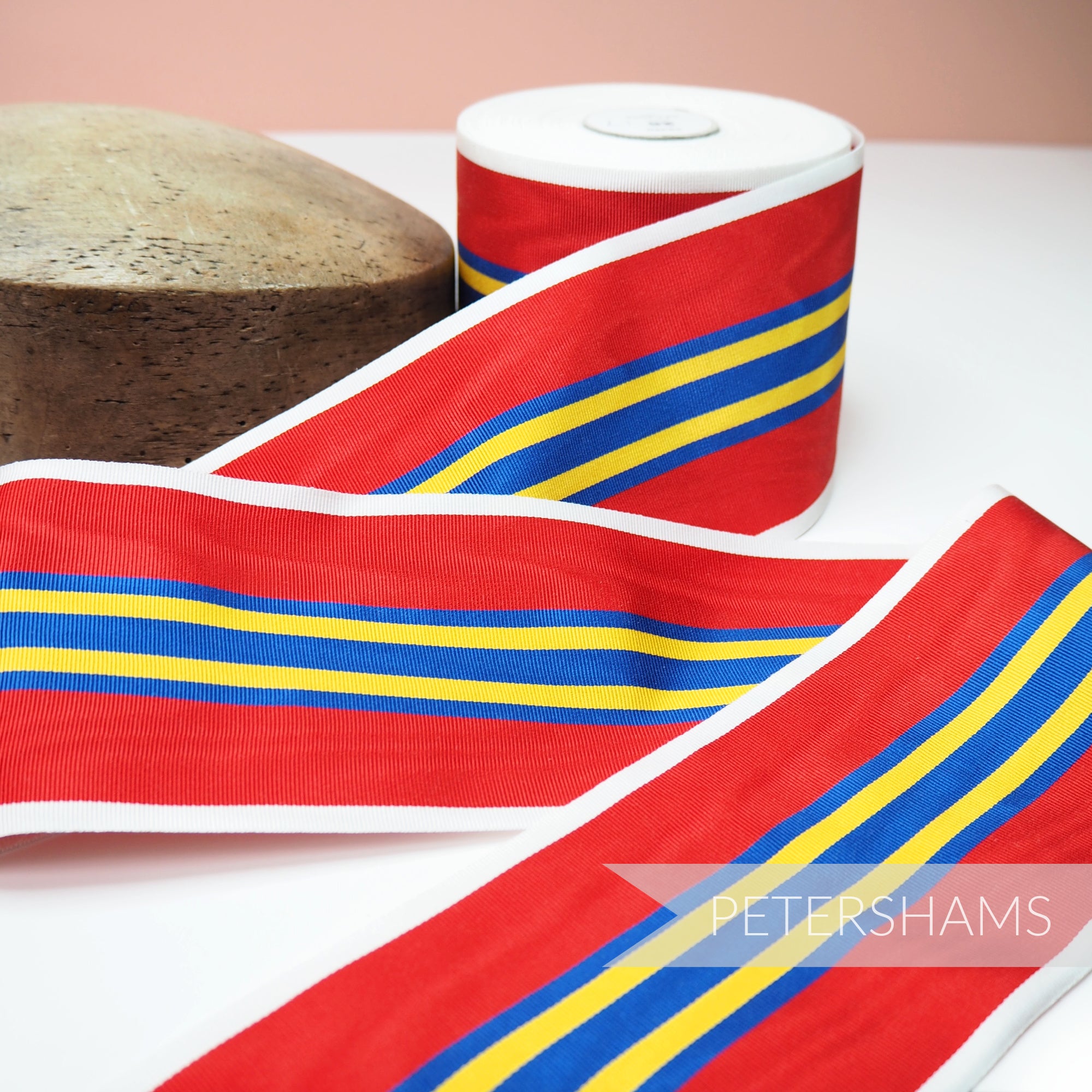 Petershams Millinery Supplies vintage 90mm wide red, blue, and yellow striped moire grosgrain ribbon for hat trimming.
