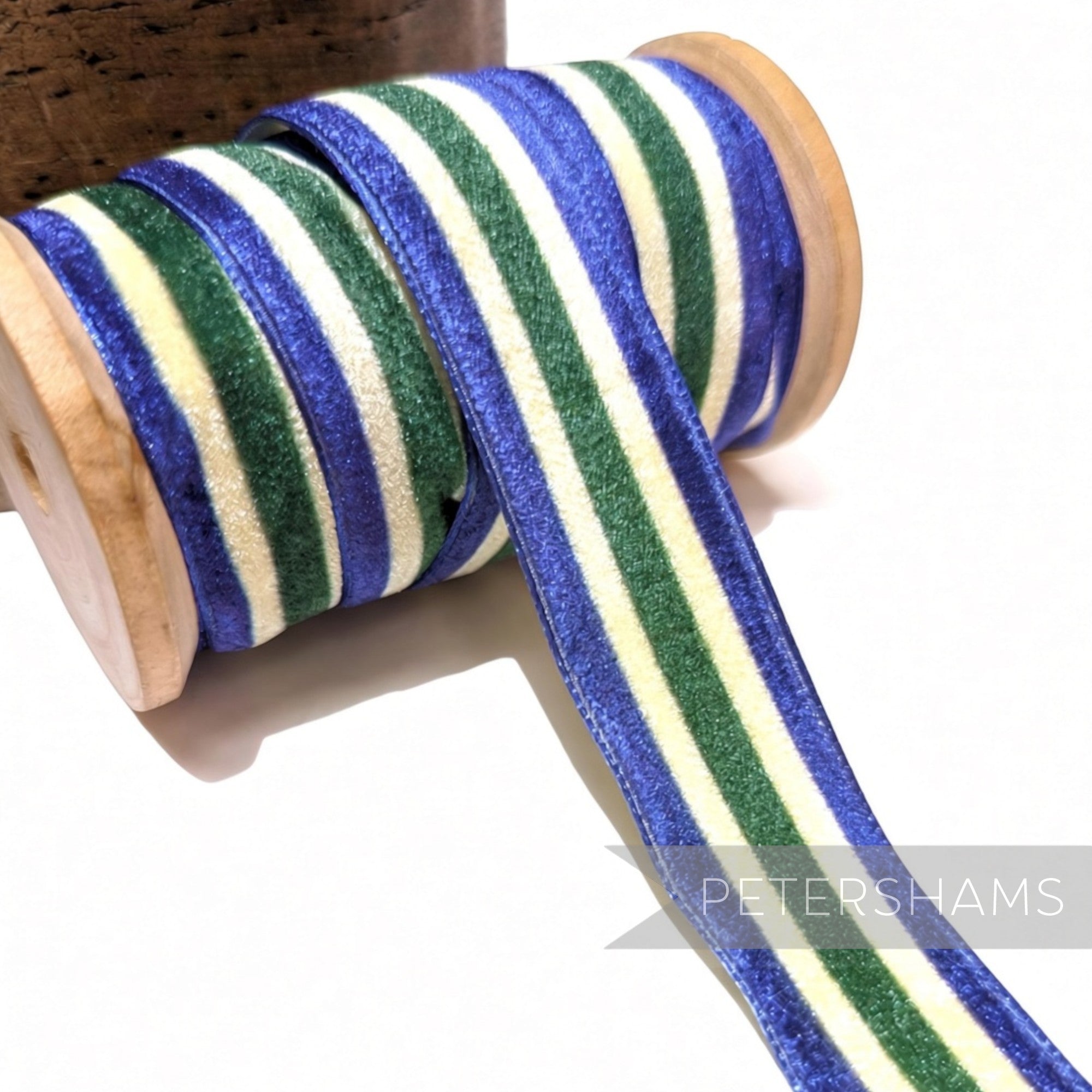Petershams Millinery Supplies 23mm striped French velvet ribbon in blue, green, and cream on a wooden spool
