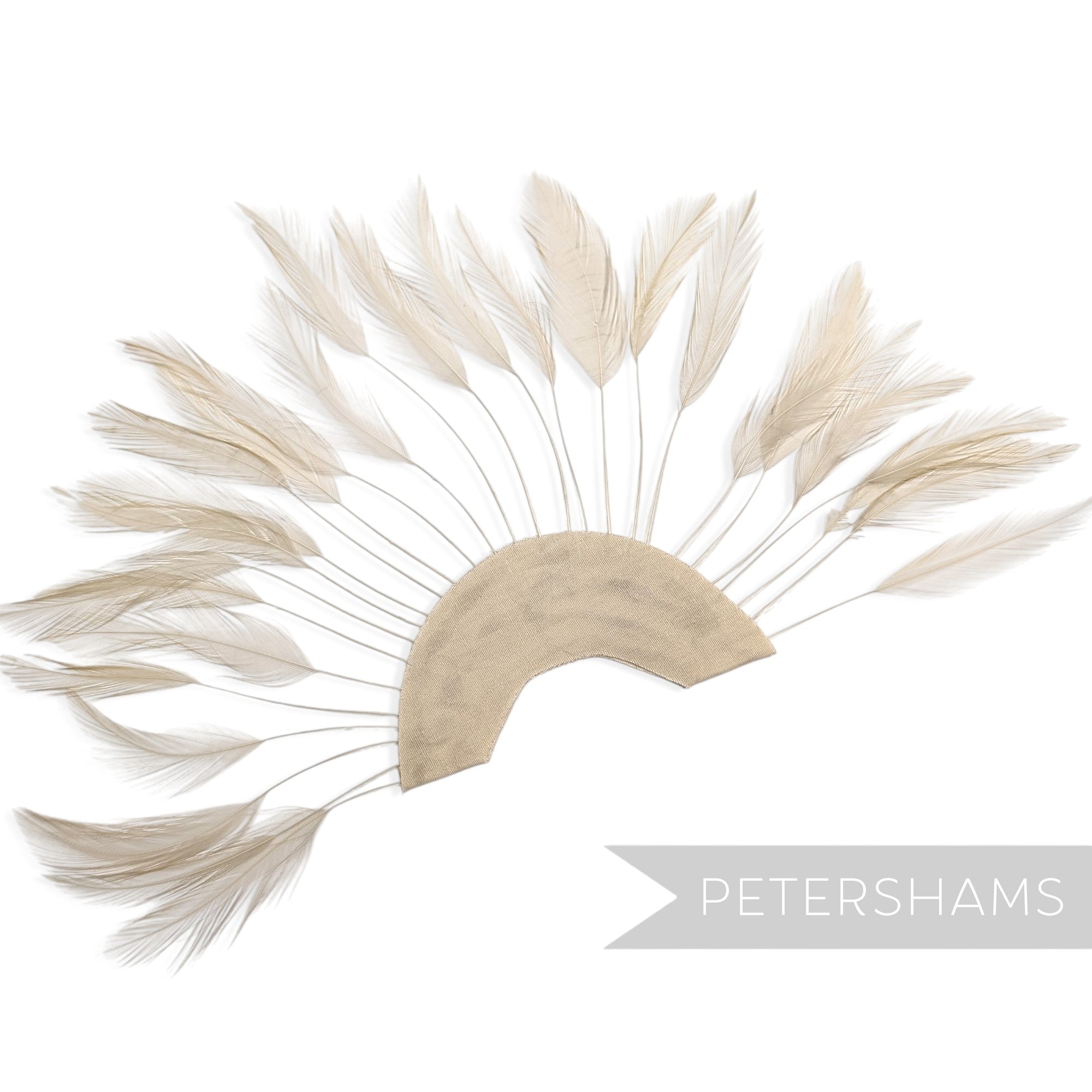 Petershams Millinery Supplies stripped hackle feather fan in light beige on a half-circle cotton base for hat trimming.