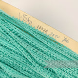 Petershams Millinery Supplies vintage 1950s English cotton Nottingham guipure lace trim in a teal leafy design.