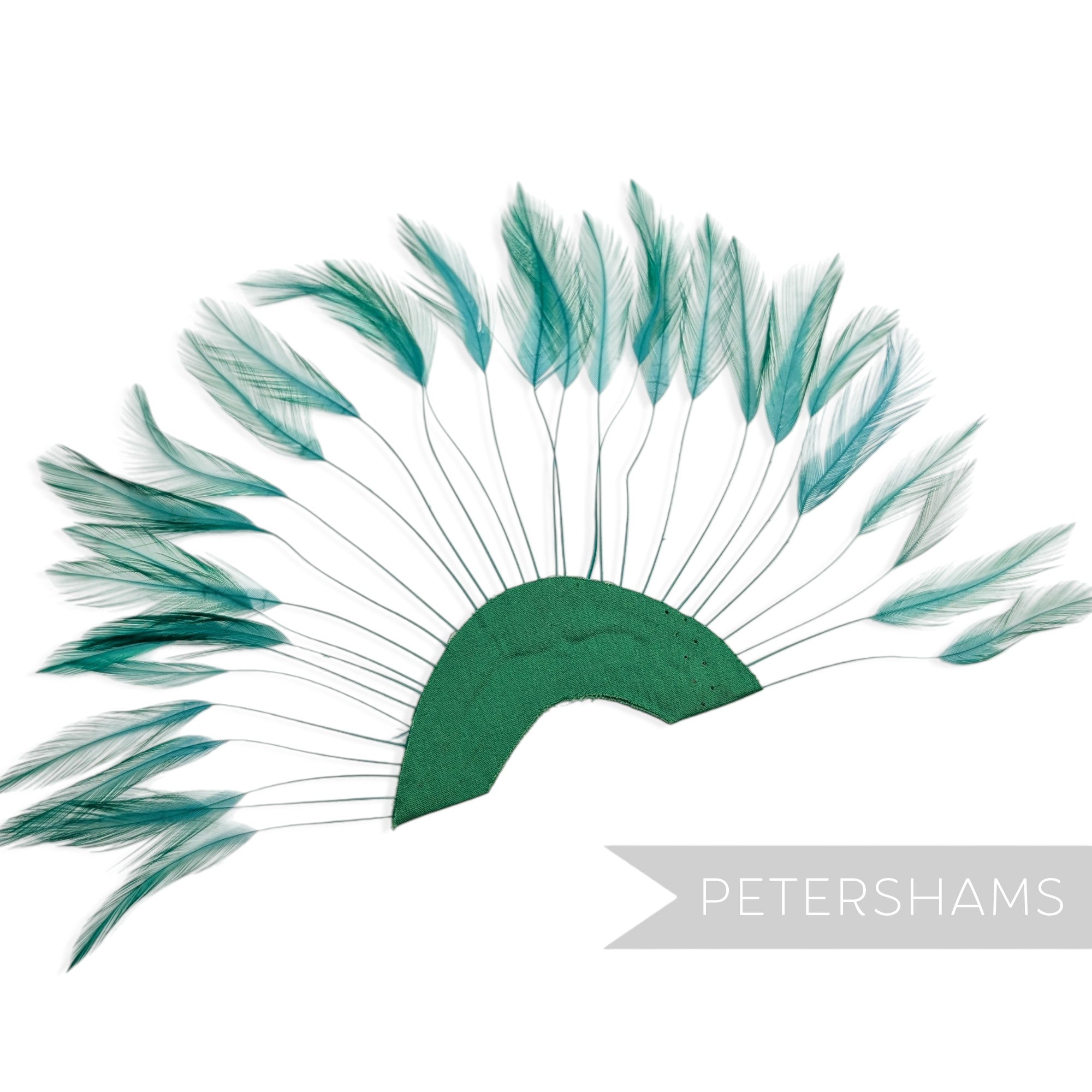 Petershams Millinery Supplies jade stripped hackle feather fan on a green cotton base for hat and fascinator trimming.