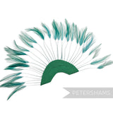 Petershams Millinery Supplies jade stripped hackle feather fan on a green cotton base for hat and fascinator trimming.