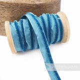 Petershams Millinery Supplies 5mm blue velvet insertion piping cord on a wooden spool for millinery and sewing
