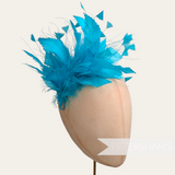 Petershams Millinery Supplies bright turquoise feather hat mount with zig zag goose and peacock feathers