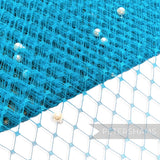 Petershams Millinery Supplies turquoise diamond-patterned veiling fabric with ivory pearl embellishments.