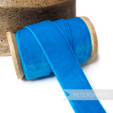 Petershams Millinery Supplies deep turquoise 28mm vintage rayon velvet ribbon on a wooden spool