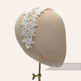 Petershams Millinery Supplies off-white V-shaped guipure lace floral rose motif on a millinery head form