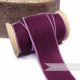 Petershams Millinery Supplies 36mm grape French velvet ribbon on a wooden  spool with a luxurious sheen.