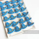 Petershams Millinery Supplies vintage 1940s blue Alpine hat buttons with raised rope and flower relief detail