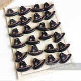Petershams Millinery Supplies vintage 1940s Alpine hat buttons in black with rope and flower relief detail