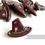 Petershams Millinery Supplies vintage 1940s Alpine hat buttons in dark brown with rope and flower relief detail