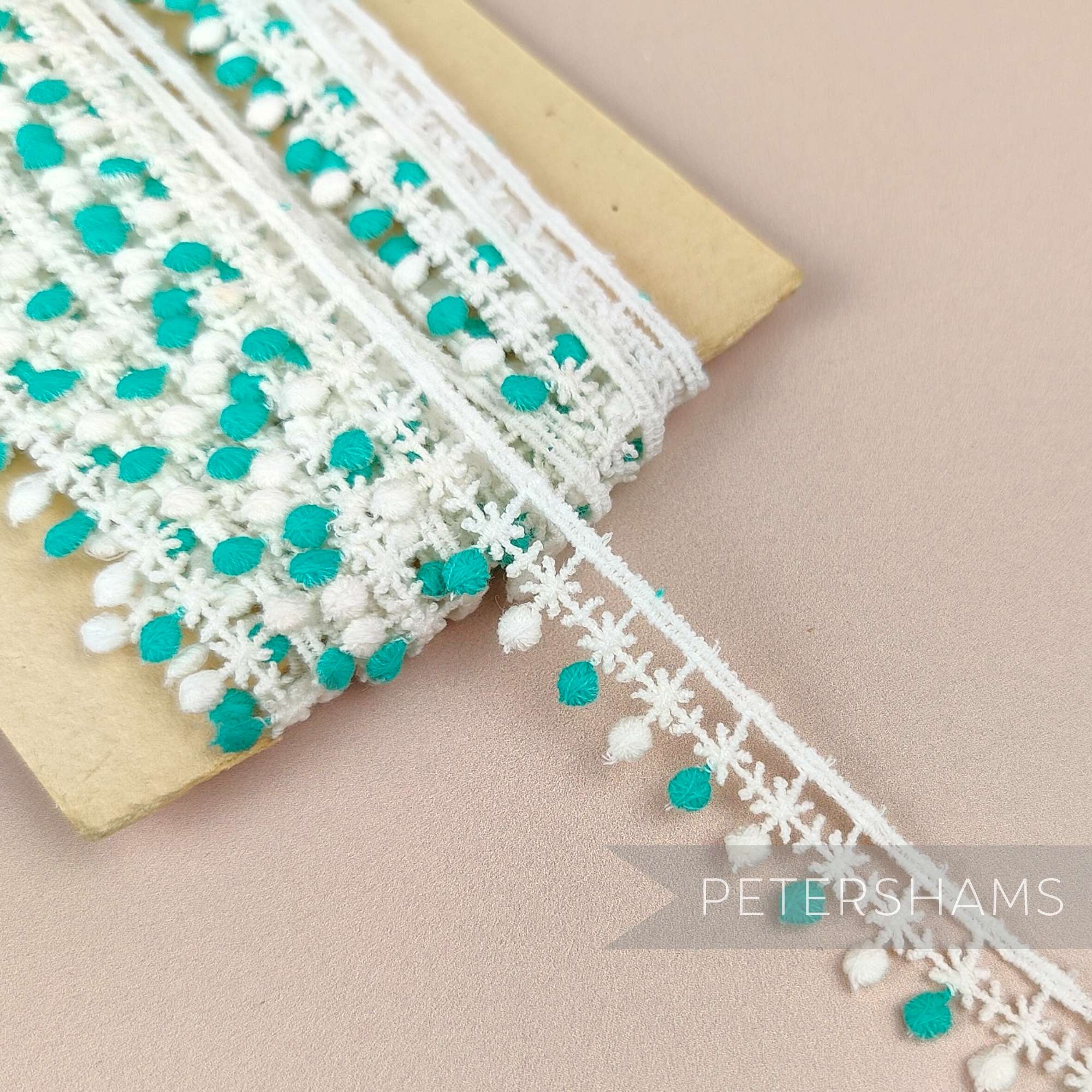 Petershams Millinery Supplies 15mm vintage 1950s Austrian cotton guipure lace trim in off-white and light jade star