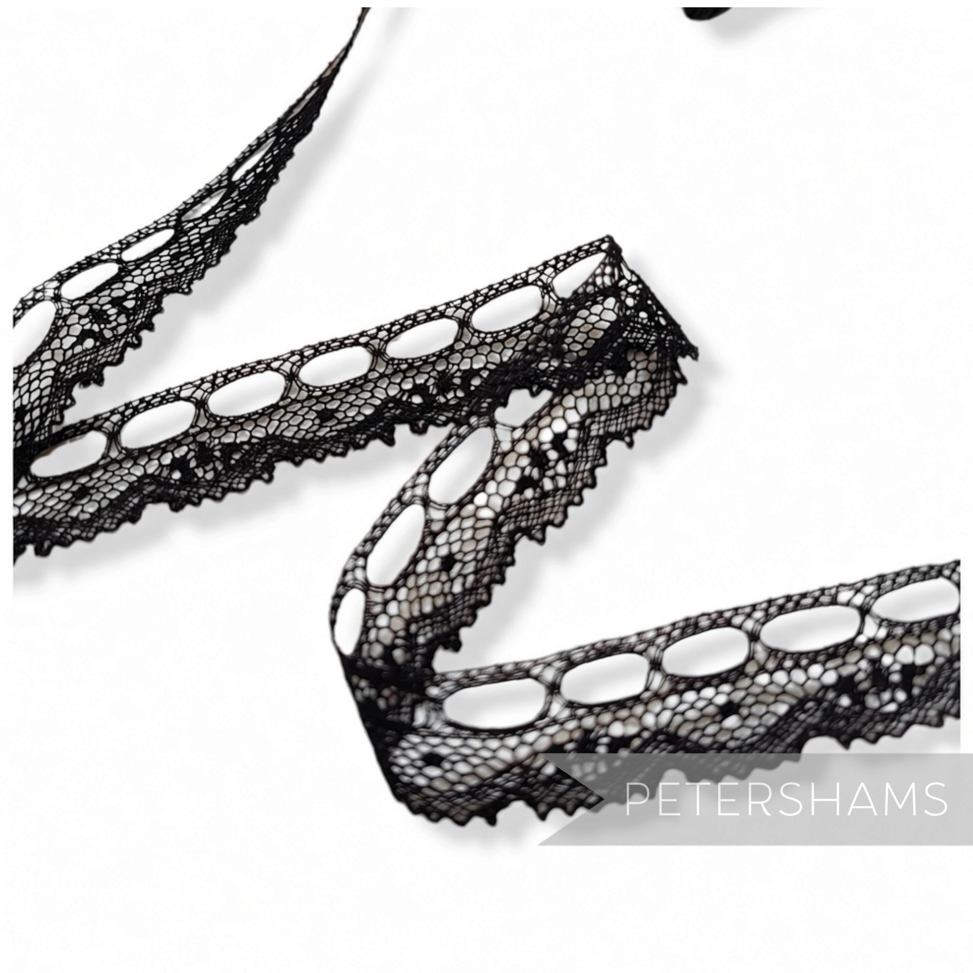 Petershams Millinery Supplies vintage 1950s black cotton lace trim with ribbon holes, 15mm wide.