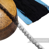 Petershams Millinery Supplies vintage black fine cotton lace trim with a scalloped looped pattern on a wooden block