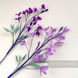 Petershams Millinery Supplies vintage blossom sprays with purple and lavender flowers on long paper-wrapped stems.