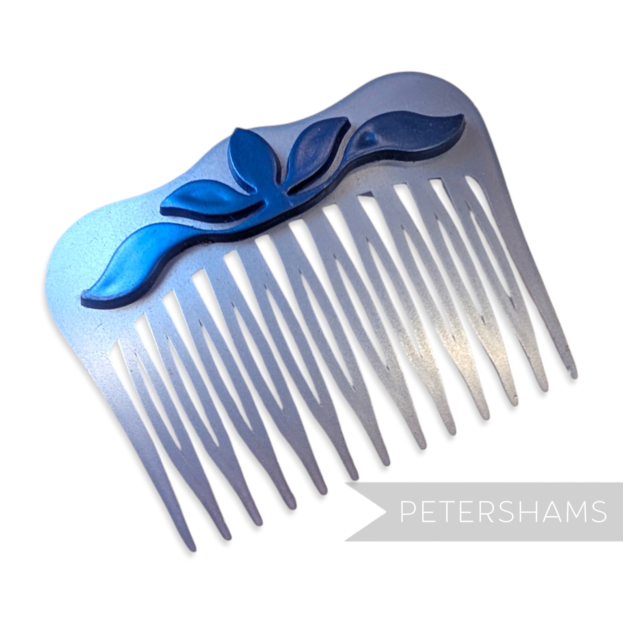 Petershams Millinery Supplies vintage blue pearlised plastic hair comb with a raised floral relief motif.
