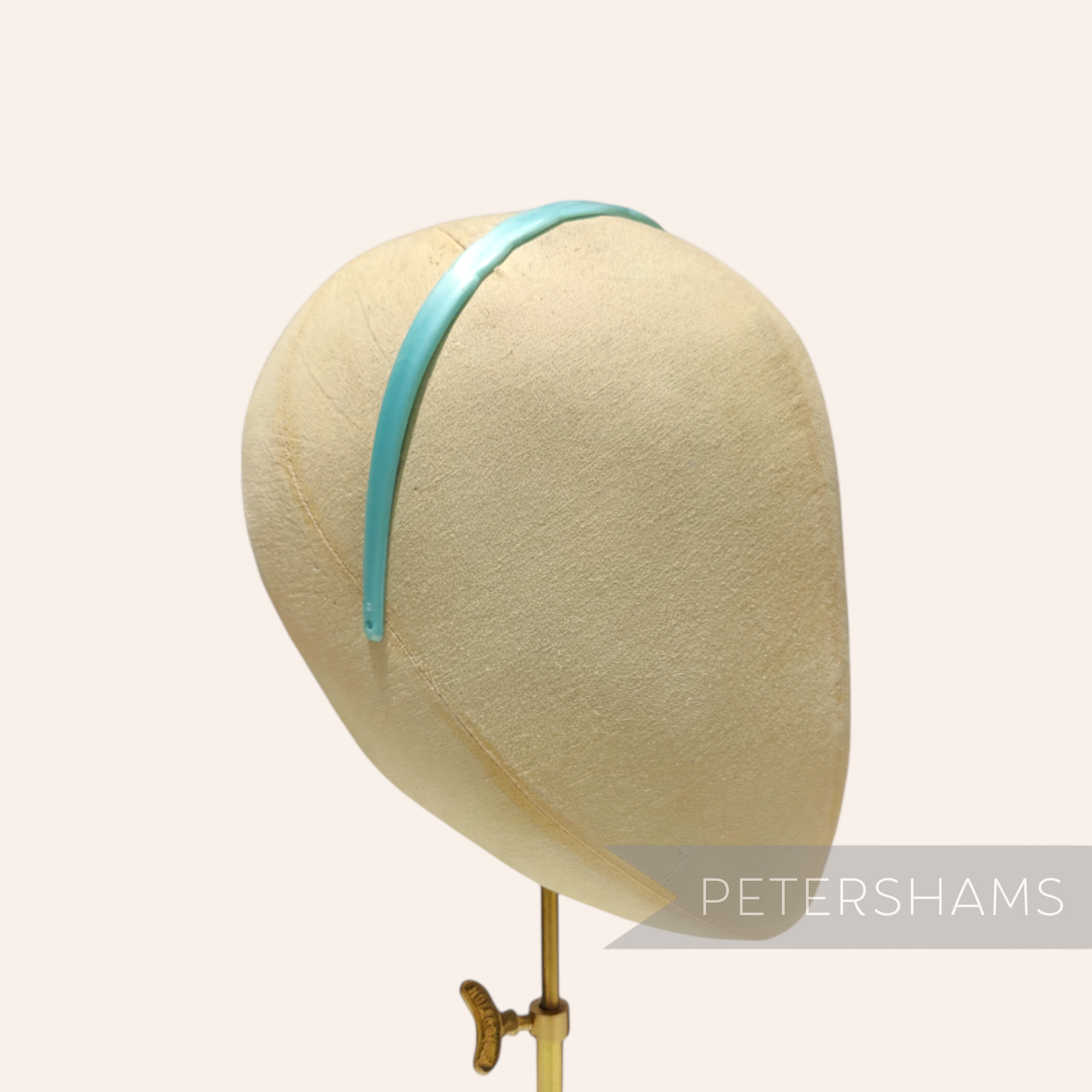 Petershams Millinery Supplies vintage 1960s light blue plastic headband with scallop edge detail and small holes for attachments.