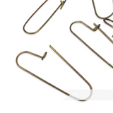 Petershams Millinery Supplies vintage 42mm brass clasp safety pins with a natural patina for labels and swing tags.