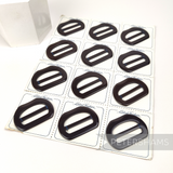 Petershams Millinery Supplies vintage 1950s chocolate brown D-shape plastic buckles on a display card.