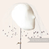 Petershams Millinery Supplies vintage 1930s honeycomb veiling round with chenille circle details on a mannequin head