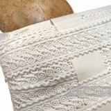 Petershams Millinery Supplies vintage 1960s off-white cotton guipure lace trim with swirly pattern and zaggy edges