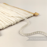 Petershams Millinery Supplies vintage 1950s English cotton Nottingham guipure lace trim with a teeny leafy design.