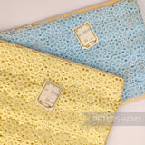 Petershams Millinery Supplies vintage Austrian daisy lace trim in blue and yellow on original cardboard spools