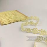 Petershams Millinery Supplies vintage 25mm pale yellow daisy lace trim on a cardboard spool