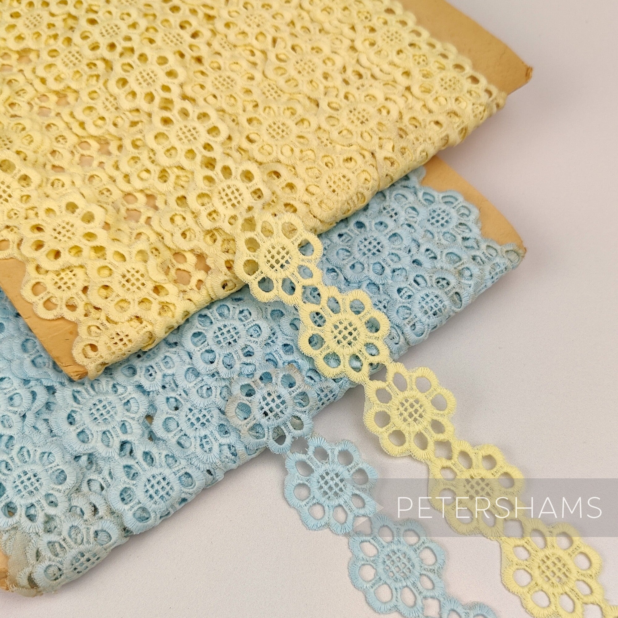 Petershams Millinery Supplies vintage Austrian daisy lace trim in yellow and blue, 25mm wide, sold by the metre.