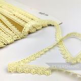 Petershams Millinery Supplies vintage 11mm cream daisy lace trim with delicate floral pattern on a card