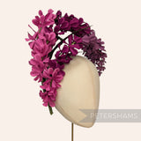 Petershams Millinery Supplies vintage 1970s Czech fabric lupin flower in graduating shades of pink and purple on a head.