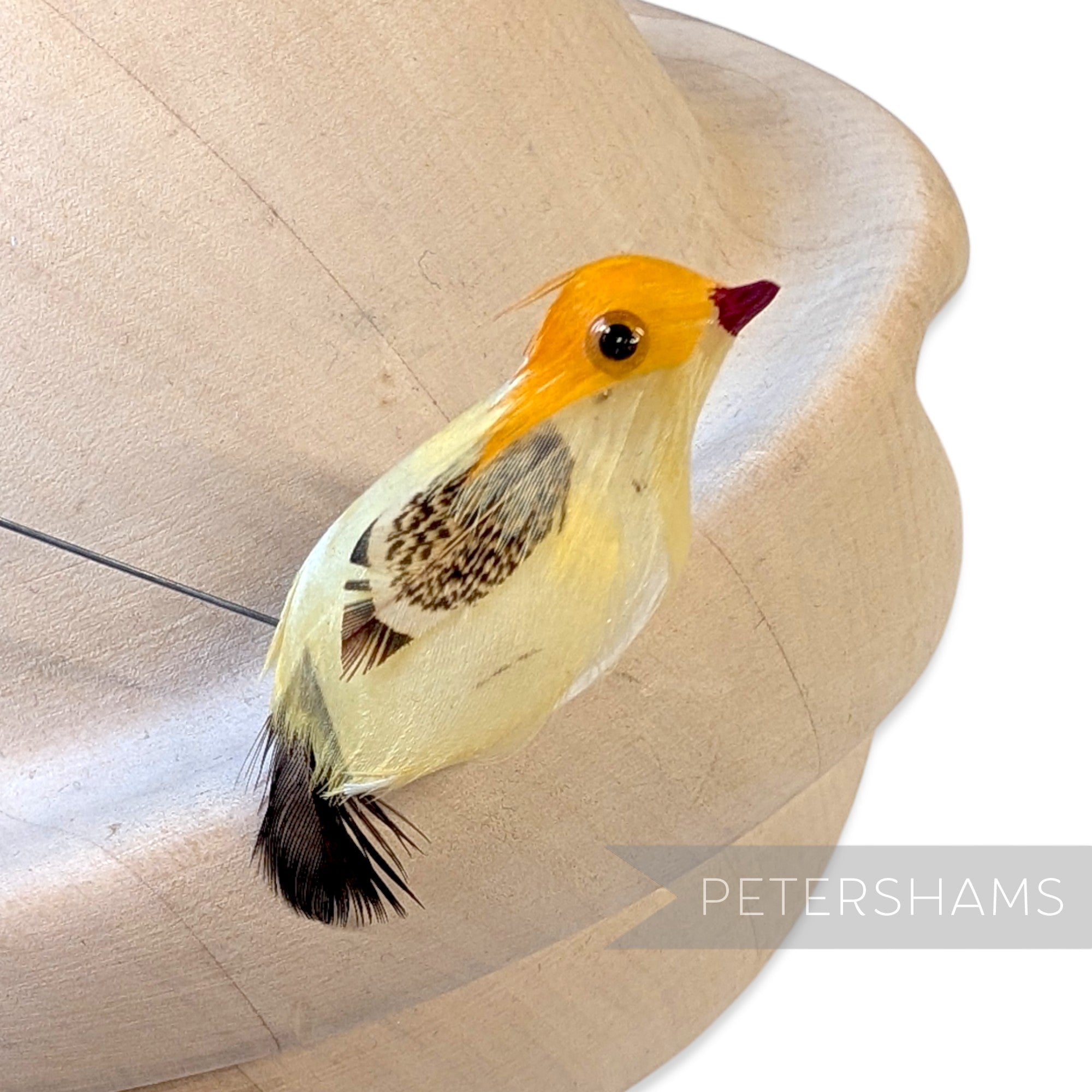 Petershams Millinery Supplies vintage yellow and brown feathered bird ornament with a wired stem for millinery crafts.