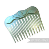 Petershams Millinery Supplies vintage 1970s pearlescent hair comb with a raised floral relief motif in sturdy plastic.