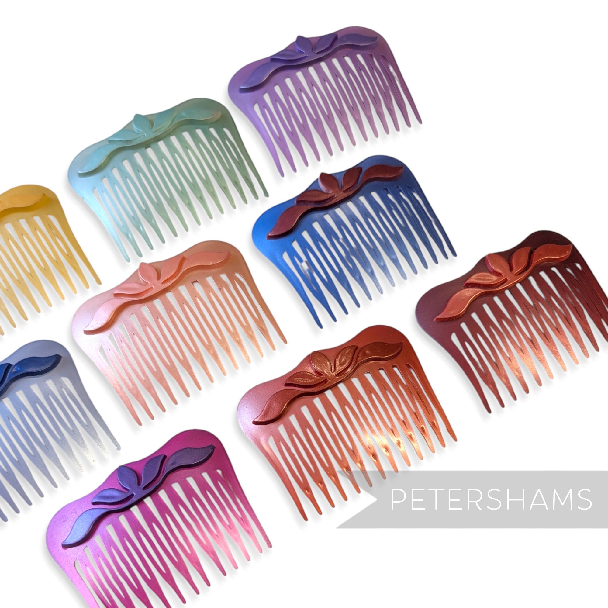 Petershams Millinery Supplies vintage 1970s 80s pearlescent plastic hair combs with raised floral relief motifs