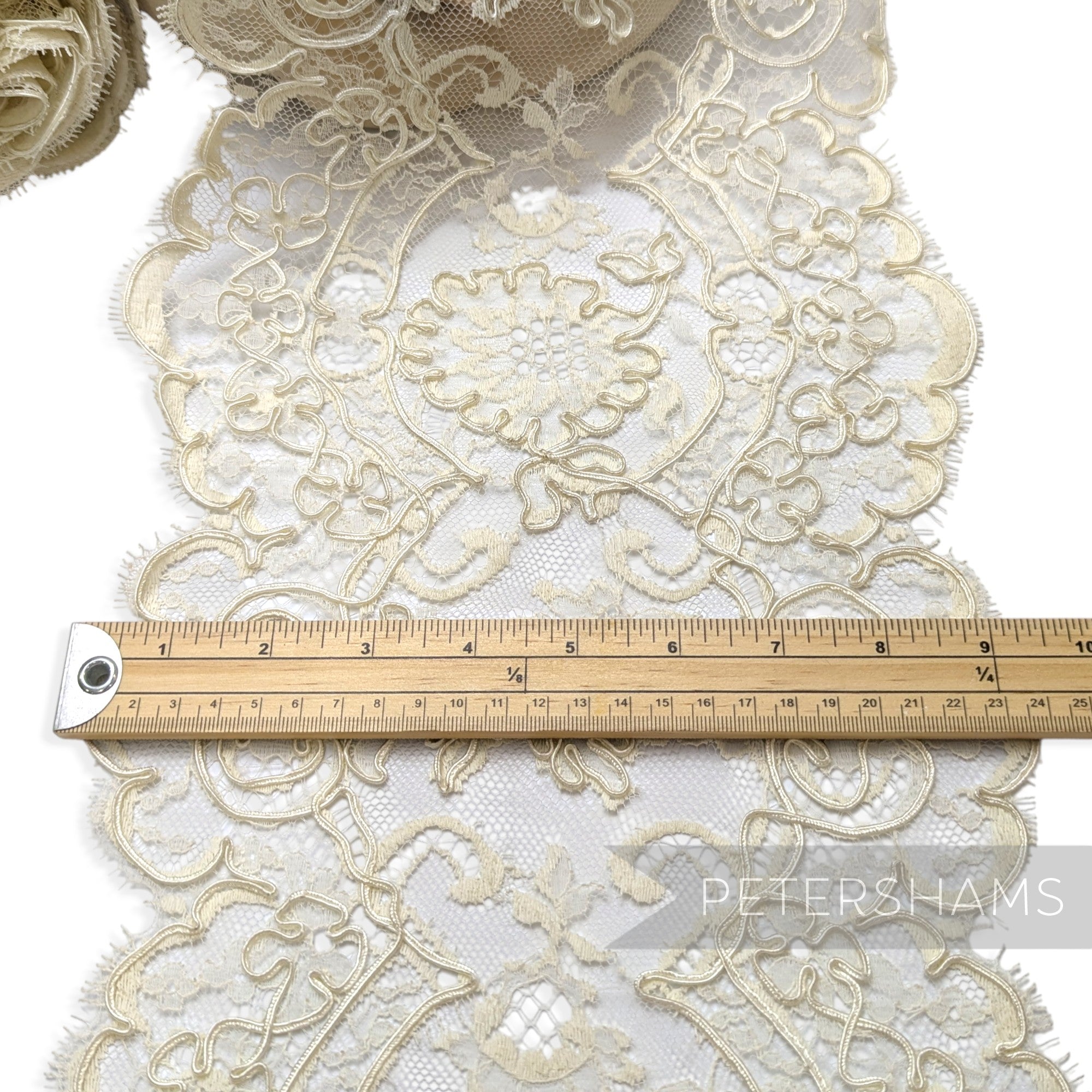 Petershams Millinery Supplies vintage 1980s cream floral lace trim with double scalloped eyelash edges on a ruler